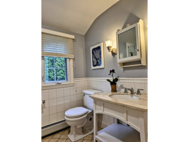 Discover the perfect blend of modern updates and timeless charm on Ridgewood Country Club in Connecticut - for sale on GolfHomes.com, golf home, golf lot