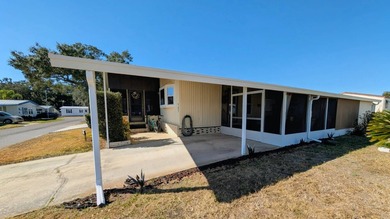 Experience the pinnacle of 55+ living in this impeccably on Grasslands Golf and Country Club in Florida - for sale on GolfHomes.com, golf home, golf lot