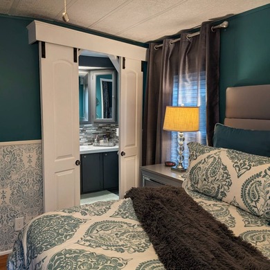 Experience the pinnacle of 55+ living in this impeccably on Grasslands Golf and Country Club in Florida - for sale on GolfHomes.com, golf home, golf lot