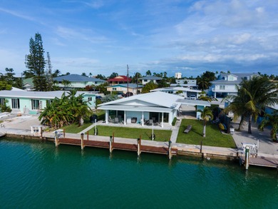 If you need more dockage than most half duplexes in Key Colony on Key Colony Beach Golf Course in Florida - for sale on GolfHomes.com, golf home, golf lot