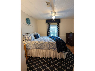 Experience the pinnacle of 55+ living in this impeccably on Grasslands Golf and Country Club in Florida - for sale on GolfHomes.com, golf home, golf lot