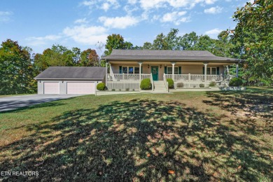 Lake-view living on a wooded acre-this 1,800 SF, single-level on Lake Tansi Village Country Club in Tennessee - for sale on GolfHomes.com, golf home, golf lot