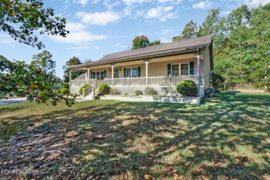 Lake-view living on a wooded acre-this 1,800 SF, single-level on Lake Tansi Village Country Club in Tennessee - for sale on GolfHomes.com, golf home, golf lot