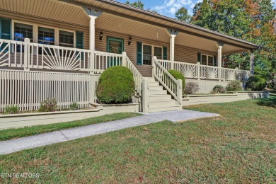 Lake-view living on a wooded acre-this 1,800 SF, single-level on Lake Tansi Village Country Club in Tennessee - for sale on GolfHomes.com, golf home, golf lot