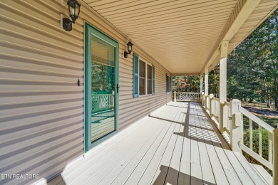 Lake-view living on a wooded acre-this 1,800 SF, single-level on Lake Tansi Village Country Club in Tennessee - for sale on GolfHomes.com, golf home, golf lot