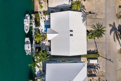 Experience the ease and elegance of true island living in this on Key Colony Beach Golf Course in Florida - for sale on GolfHomes.com, golf home, golf lot