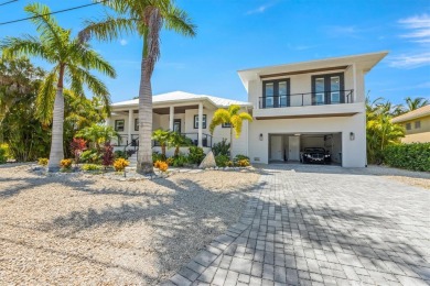 This new construction is a dream come true for boaters and water on Key Royale Club in Florida - for sale on GolfHomes.com, golf home, golf lot