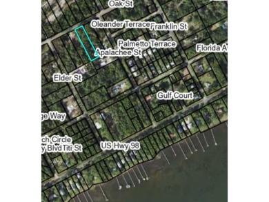 Nestled down Pinewood Avenue in charming Carrabelle, Florida on St. James Bay in Florida - for sale on GolfHomes.com, golf home, golf lot
