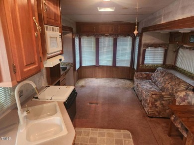 This ready to enjoy property has everything you need for a on River Golf and Country Club at Lake Royale in North Carolina - for sale on GolfHomes.com, golf home, golf lot