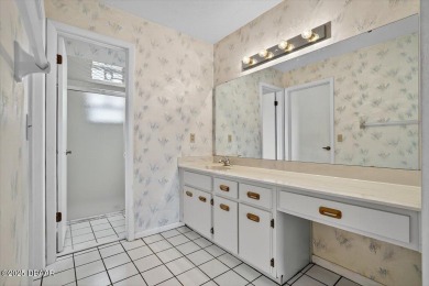 Discover the charm of this 3 bedroom, 2 and 1/2 bath home in the on The Club At Pelican Bay - North Course in Florida - for sale on GolfHomes.com, golf home, golf lot
