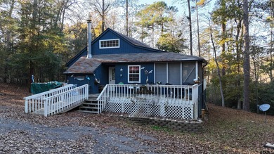 Charming cottage retreat in the heart of Holly Lake Ranch! This on Holly Lake Ranch Golf Club in Texas - for sale on GolfHomes.com, golf home, golf lot