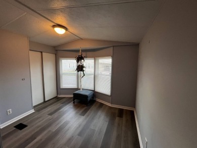 This beautifully updated 2-bedroom, 2-bathroom unfurnished home on Lake Henry Golf Club in Florida - for sale on GolfHomes.com, golf home, golf lot