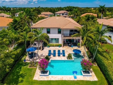 Nestled on the golf course & water in Parkland Golf & Country on Parkland Golf Club in Florida - for sale on GolfHomes.com, golf home, golf lot