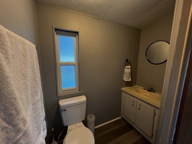 This beautifully updated 2-bedroom, 2-bathroom unfurnished home on Lake Henry Golf Club in Florida - for sale on GolfHomes.com, golf home, golf lot