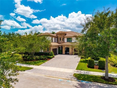 Nestled on the golf course & water in Parkland Golf & Country on Parkland Golf Club in Florida - for sale on GolfHomes.com, golf home, golf lot