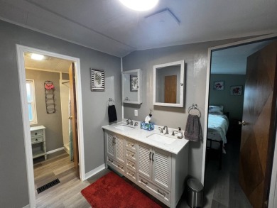This beautifully updated 2-bedroom, 2-bathroom unfurnished home on Lake Henry Golf Club in Florida - for sale on GolfHomes.com, golf home, golf lot