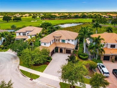 Nestled on the golf course & water in Parkland Golf & Country on Parkland Golf Club in Florida - for sale on GolfHomes.com, golf home, golf lot