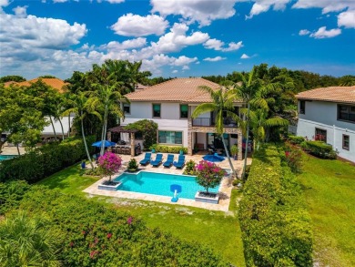 Nestled on the golf course & water in Parkland Golf & Country on Parkland Golf Club in Florida - for sale on GolfHomes.com, golf home, golf lot