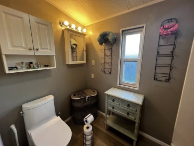 This beautifully updated 2-bedroom, 2-bathroom unfurnished home on Lake Henry Golf Club in Florida - for sale on GolfHomes.com, golf home, golf lot