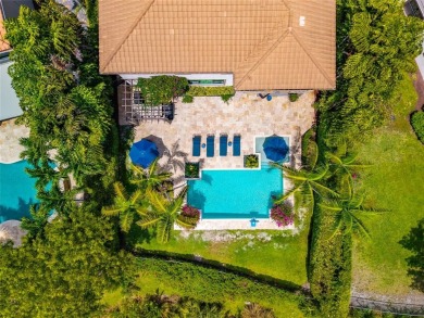 Nestled on the golf course & water in Parkland Golf & Country on Parkland Golf Club in Florida - for sale on GolfHomes.com, golf home, golf lot