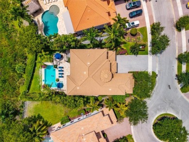 Nestled on the golf course & water in Parkland Golf & Country on Parkland Golf Club in Florida - for sale on GolfHomes.com, golf home, golf lot