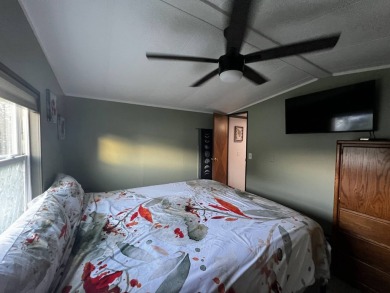 This beautifully updated 2-bedroom, 2-bathroom unfurnished home on Lake Henry Golf Club in Florida - for sale on GolfHomes.com, golf home, golf lot