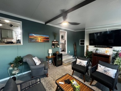 This beautifully updated 2-bedroom, 2-bathroom unfurnished home on Lake Henry Golf Club in Florida - for sale on GolfHomes.com, golf home, golf lot
