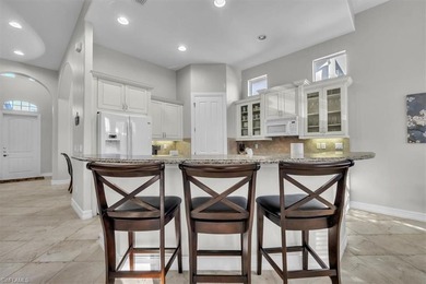 Welcome home to this elegant and well-maintained Stock Tivoli on The Classics Country Club At Lely Resort in Florida - for sale on GolfHomes.com, golf home, golf lot