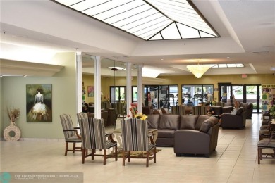 Enjoy spacious, open-concept living with stunning views in this on Sunrise Lakes Phase IV Golf Course in Florida - for sale on GolfHomes.com, golf home, golf lot