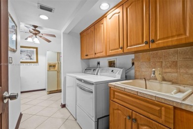 Luxury living in this Waterfront Mediterranean Estate in on The Diplomat Golf Resort and Spa in Florida - for sale on GolfHomes.com, golf home, golf lot
