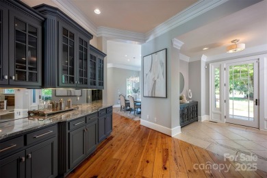 Impeccable craftsmanship and 305' of pristine shoreline define on Trump National Golf Club Charlotte in North Carolina - for sale on GolfHomes.com, golf home, golf lot