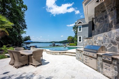 Impeccable craftsmanship and 305' of pristine shoreline define on Trump National Golf Club Charlotte in North Carolina - for sale on GolfHomes.com, golf home, golf lot