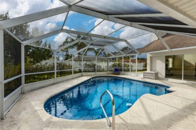 Solar Heated Pool Home with over 2,700 Sq. Ft. of living space on The Grand Club - Pine Lakes Course in Florida - for sale on GolfHomes.com, golf home, golf lot