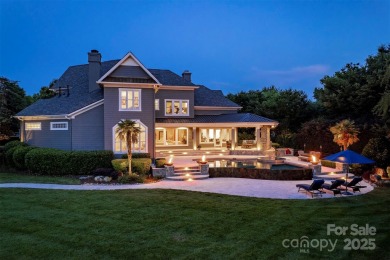 Impeccable craftsmanship and 305' of pristine shoreline define on Trump National Golf Club Charlotte in North Carolina - for sale on GolfHomes.com, golf home, golf lot