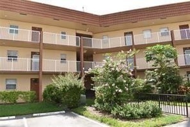 Two-bedroom, two-bathroom corner unit in the second floor in the on Sunrise Lakes Phase III in Florida - for sale on GolfHomes.com, golf home, golf lot