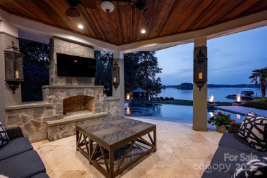 Impeccable craftsmanship and 305' of pristine shoreline define on Trump National Golf Club Charlotte in North Carolina - for sale on GolfHomes.com, golf home, golf lot