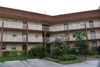 Two-bedroom, two-bathroom corner unit in the second floor in the on Sunrise Lakes Phase III in Florida - for sale on GolfHomes.com, golf home, golf lot