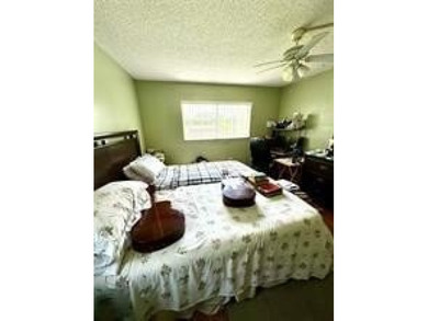 Two-bedroom, two-bathroom corner unit in the second floor in the on Sunrise Lakes Phase III in Florida - for sale on GolfHomes.com, golf home, golf lot