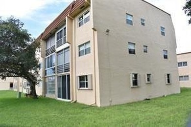 Two-bedroom, two-bathroom corner unit in the second floor in the on Sunrise Lakes Phase III in Florida - for sale on GolfHomes.com, golf home, golf lot