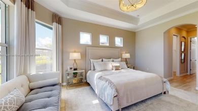 This stunning home boasts panoramic views of the lake and golf on Panther Run Golf Club in Florida - for sale on GolfHomes.com, golf home, golf lot