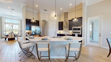 This stunning home boasts panoramic views of the lake and golf on Panther Run Golf Club in Florida - for sale on GolfHomes.com, golf home, golf lot