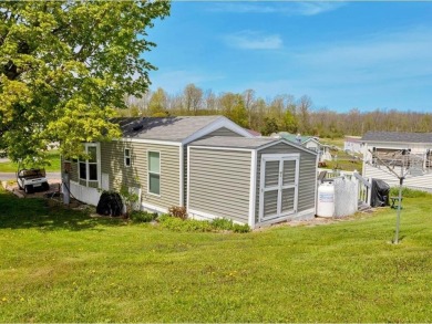 Welcome to this very cute and stylish 1-bedroom seasonal cottage on Apple Island Golf Course At Apple Island Resort in Vermont - for sale on GolfHomes.com, golf home, golf lot