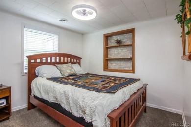 Nestled in the gated community of Lost Lake Woods Club in on Lost Lake Woods Club in Michigan - for sale on GolfHomes.com, golf home, golf lot