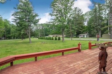 Nestled in the gated community of Lost Lake Woods Club in on Lost Lake Woods Club in Michigan - for sale on GolfHomes.com, golf home, golf lot