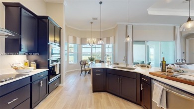 This stunning home boasts panoramic views of the lake and golf on Panther Run Golf Club in Florida - for sale on GolfHomes.com, golf home, golf lot