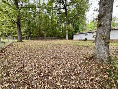 Nestled in the sought-after Diamondhead community, this on Diamondhead Golf and Country Club in Arkansas - for sale on GolfHomes.com, golf home, golf lot