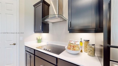 This stunning home boasts panoramic views of the lake and golf on Panther Run Golf Club in Florida - for sale on GolfHomes.com, golf home, golf lot