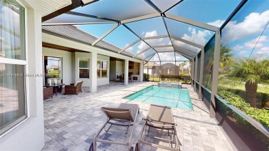 This stunning home boasts panoramic views of the lake and golf on Panther Run Golf Club in Florida - for sale on GolfHomes.com, golf home, golf lot