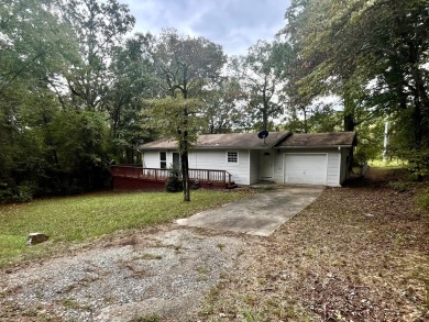 Nestled in the sought-after Diamondhead community, this on Diamondhead Golf and Country Club in Arkansas - for sale on GolfHomes.com, golf home, golf lot