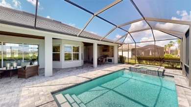 This stunning home boasts panoramic views of the lake and golf on Panther Run Golf Club in Florida - for sale on GolfHomes.com, golf home, golf lot